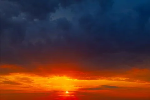Colorful dramatic sky with blue clouds at twilight Stock Photos
