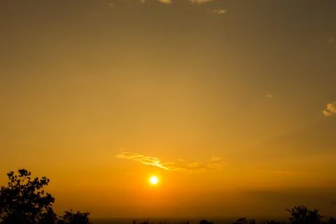 Colorful dramatic sky with cloud at Sunrise.Sky with sun background Stock Photos