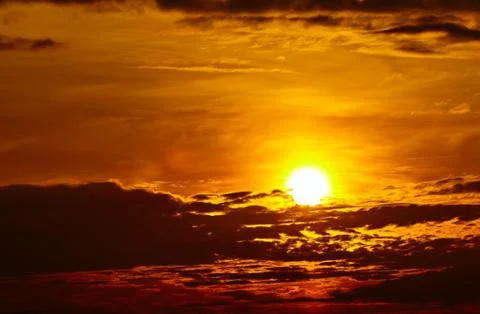 Colorful dramatic sky with cloud at sunset. Golden sky background Stock Photos