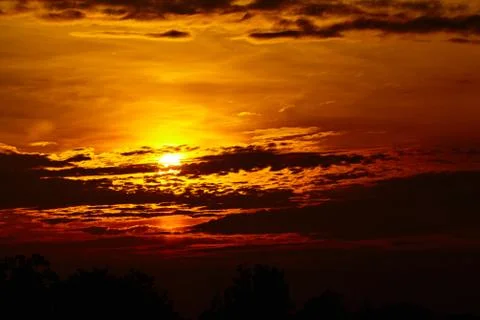 Colorful dramatic sky with cloud at sunset. Golden sky background Stock Photos