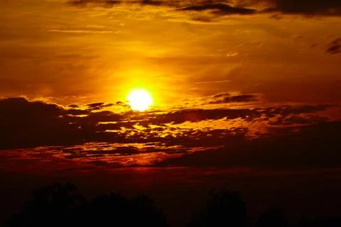 Colorful dramatic sky with cloud at sunset. Golden sky background Stock Photos