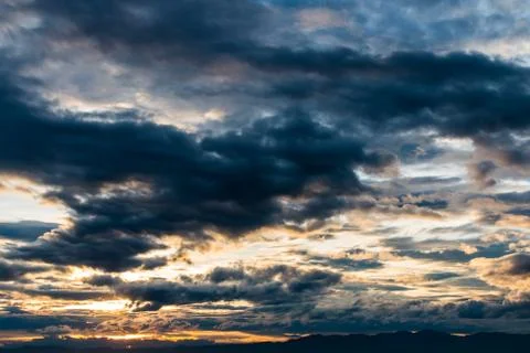 Colorful dramatic sky with cloud at sunset. Stock Photos