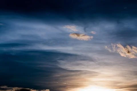 Colorful dramatic sky with cloud at sunset. Stock Photos