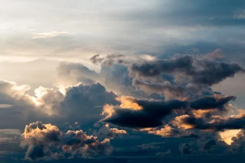 Colorful dramatic sky with cloud at sunset. Stock Photos