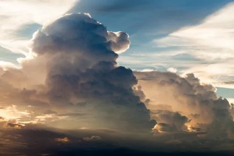 Colorful dramatic sky with cloud at sunset. Stock Photos