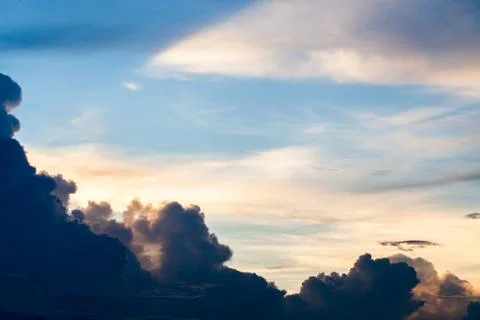 Colorful dramatic sky with cloud at sunset. Stock Photos