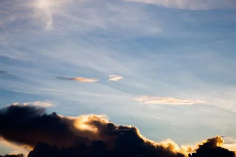 Colorful dramatic sky with cloud at sunset. Stock Photos