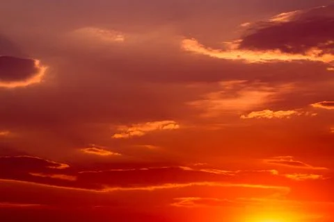 Colorful dramatic sky with cloud at sunset. Stock Photos