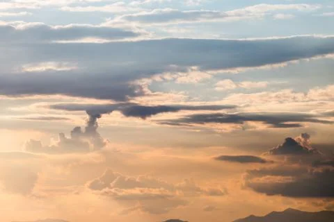 Colorful dramatic sky with cloud at sunset. Stock Photos