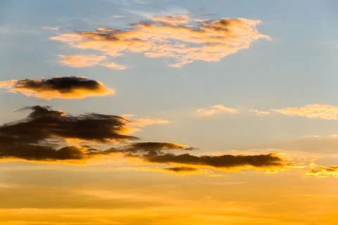 Colorful dramatic sky with cloud at sunset. Stock Photos