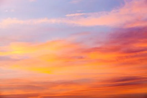 Colorful dramatic sky with cloud at sunset. Stock Photos