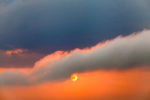 Colorful dramatic sky with cloud at sunset. Stock Photos