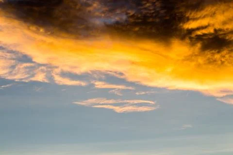Colorful dramatic sky with cloud at sunset. Stock Photos