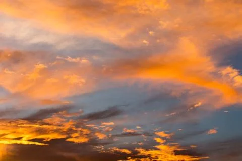 Colorful dramatic sky with cloud at sunset. Stock Photos