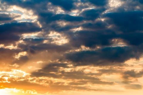 Colorful dramatic sky with cloud at sunset. Stock Photos