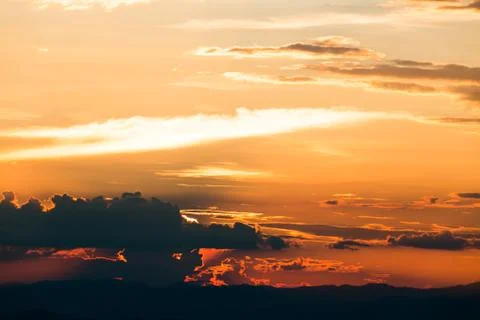 Colorful dramatic sky with cloud at sunset. Stockfoto's