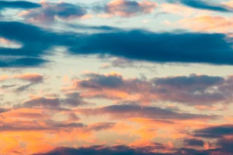 Colorful dramatic sky with cloud at sunset. Stock Photos