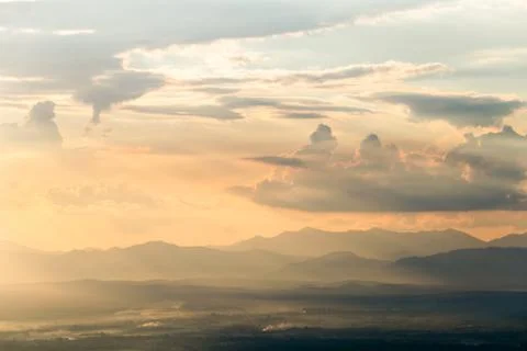 Colorful dramatic sky with cloud at sunset. Stock Photos