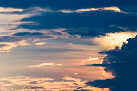 Colorful dramatic sky with cloud at sunset. Stock Photos