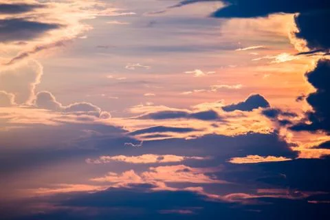 Colorful dramatic sky with cloud at sunset. Stock Photos