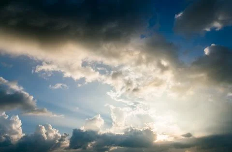 Colorful dramatic sky with cloud at sunset. Stock Photos