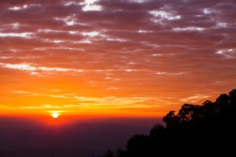 Colorful dramatic sky with cloud at sunset. Stock Photos