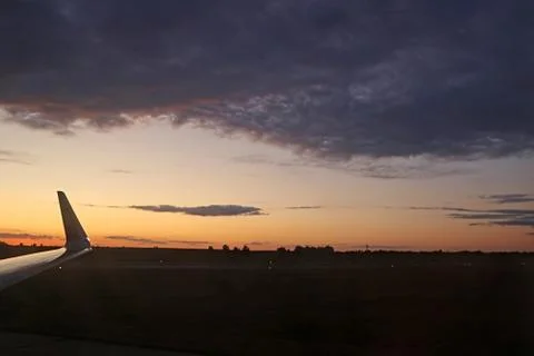 Colorful dramatic sky with cloud at sunset over fields and runway of Boryspil Stock Photos