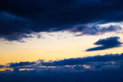Colorful dramatic sky with cloud at sunset. Stock Photos