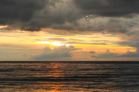 Colorful dramatic sky with cloud at sunset over the indian ocean Stock Photos