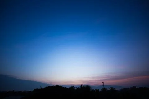 Colorful dramatic sky with cloud at sunset. Stock Photos