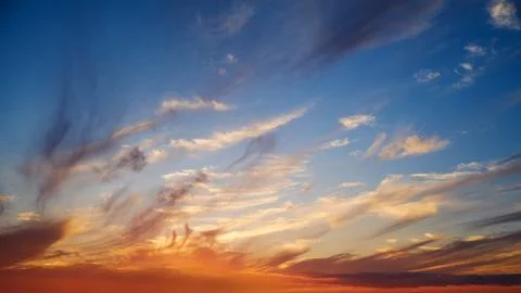 Colorful dramatic sky with cloud at sunset.Sky clouds at sunset. Stock Photos