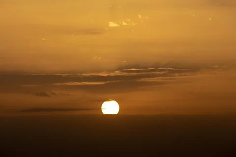 Colorful dramatic sky with cloud at sunset.Sky with sun background Stock Photos