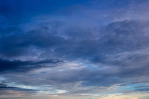 Colorful dramatic sky with cloud at sunset.Sky with sun background Stock Photos