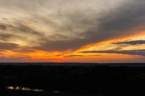 Colorful dramatic sky at sunset. Cold evening Stock Photos