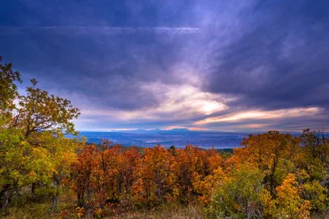 Colorful dramatic sunset sky over the city of moab fall colors Stock Photos