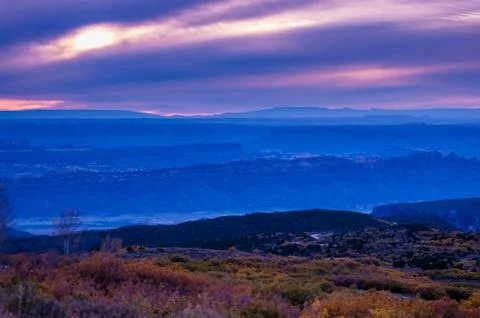 Colorful dramatic sunset sky over the city of moab fall colors Stock Photos