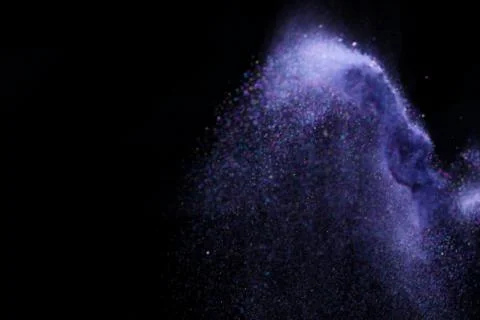 Colorful dust explode at black background. Celebrate Indian Holi festival of  Stock Photos