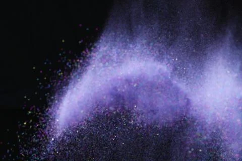 Colorful dust explode at black background. Celebrate Indian Holi festival of  Foto stock