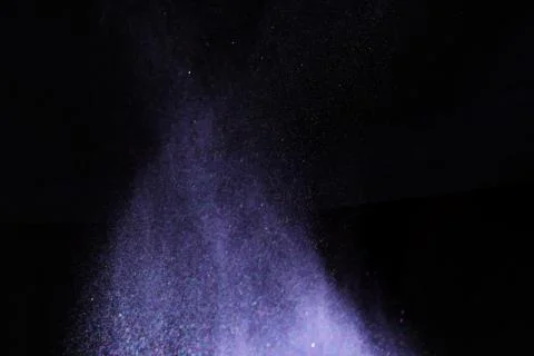 Colorful dust explode at black background. Celebrate Indian Holi festival of  Stock Photos