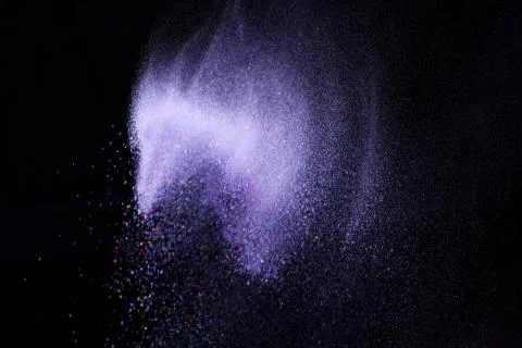 Colorful dust explode at black background. Celebrate Indian Holi festival of  Stock Photos
