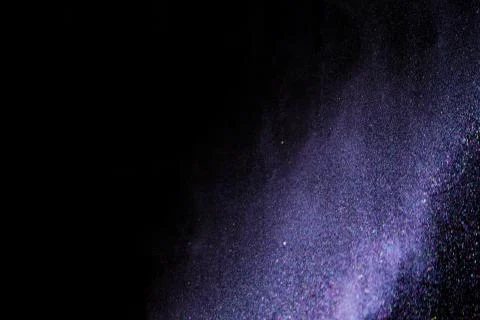 Colorful dust explode at black background. Celebrate Indian Holi festival of  Stock Photos