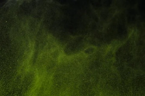 Colorful dust explode at black background. Celebrate Indian Holi festival of  Stock Photos