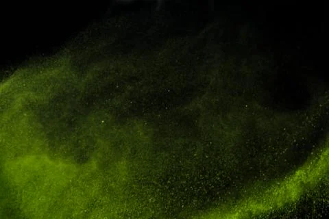Colorful dust explode at black background. Celebrate Indian Holi festival of  Stock Photos
