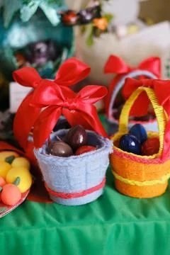 Colorful Easter baskets filled with decorative eggs, adorned with vibrant Stock Photos