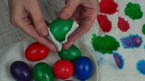 Colorful Easter chicken eggs painted in different colors lie on a white plate on Video stock 242382091