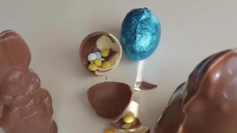 Colorful Easter Chocolate Eggs with Candy for a Joyful Celebration Stock Footage 332944171