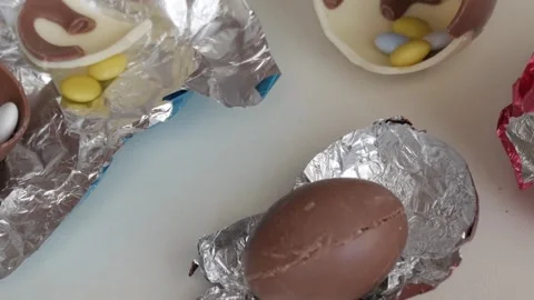 Colorful Easter Chocolate Eggs Filled with Candies for a Joyful Celebration Stock Footage 333110933