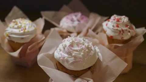 Colorful Easter cupcakes with icing and sprinkles Stock Footage 308320700