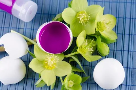 Colorful Easter decoration with egg shell filled with magenta tempera paint a Stock Photos