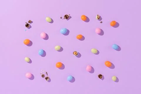 Colorful easter dragee on a violet background Stock Photos